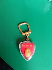 Porte clés BOURBON pneus 🛞  FIRESTONE fond rouge TBE.