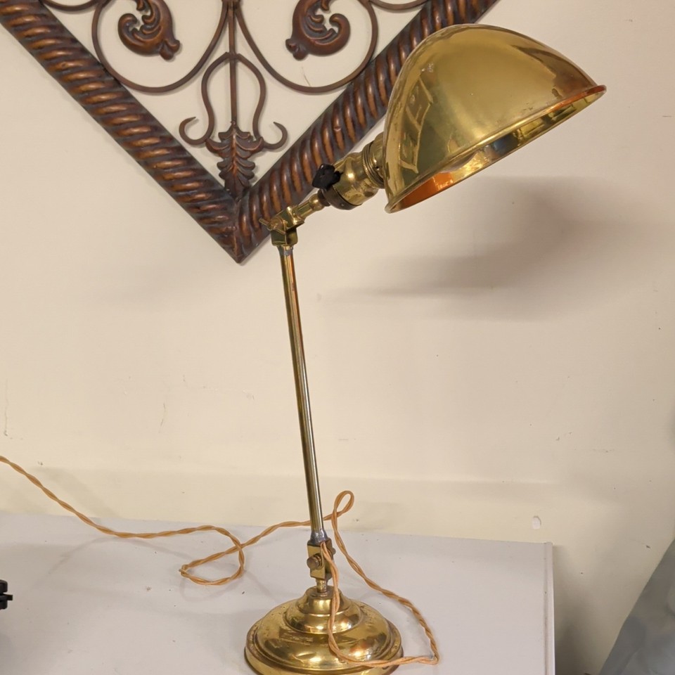 A fully working antique articulating brass Art Deco task lamp — the kind of sculptural, functional heirloom that anchors an entire room.