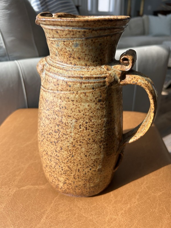 Stoneware pottery pitcher with speckled brown glaze