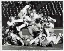 1979 Press Photo Purdue's Wally Jones With Football Contacts UCLA's Kenny Easly