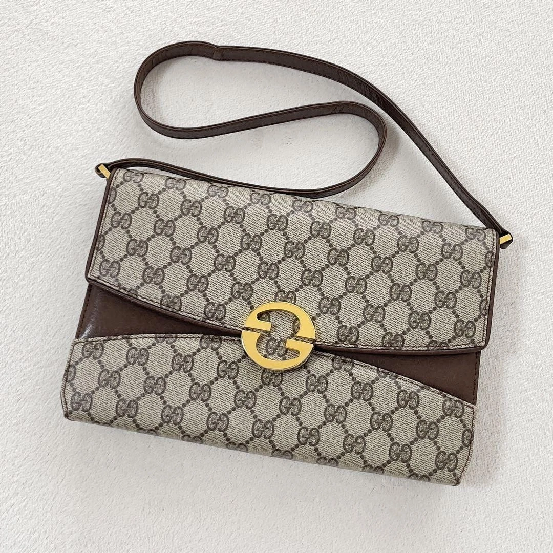 Sac bandoulière Gucci vintage GG Supreme avec quincaillerie dorée PVC cuir