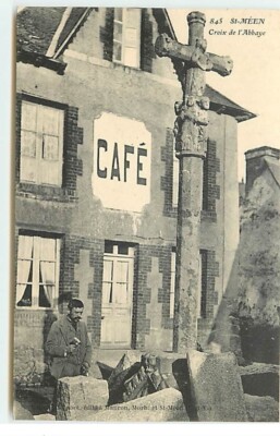 SAINT-MEEN - Abteikreuz - Steinmetz vor einem Café - 20536