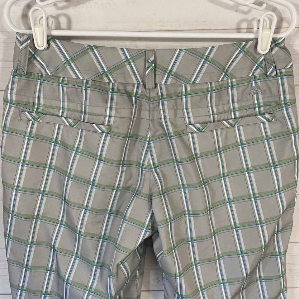 Shorts de golfe Adidas feminino xadrez cinza/verde tamanho 4 bolsos ClimaLite frente plana - Imagem 4 de 4