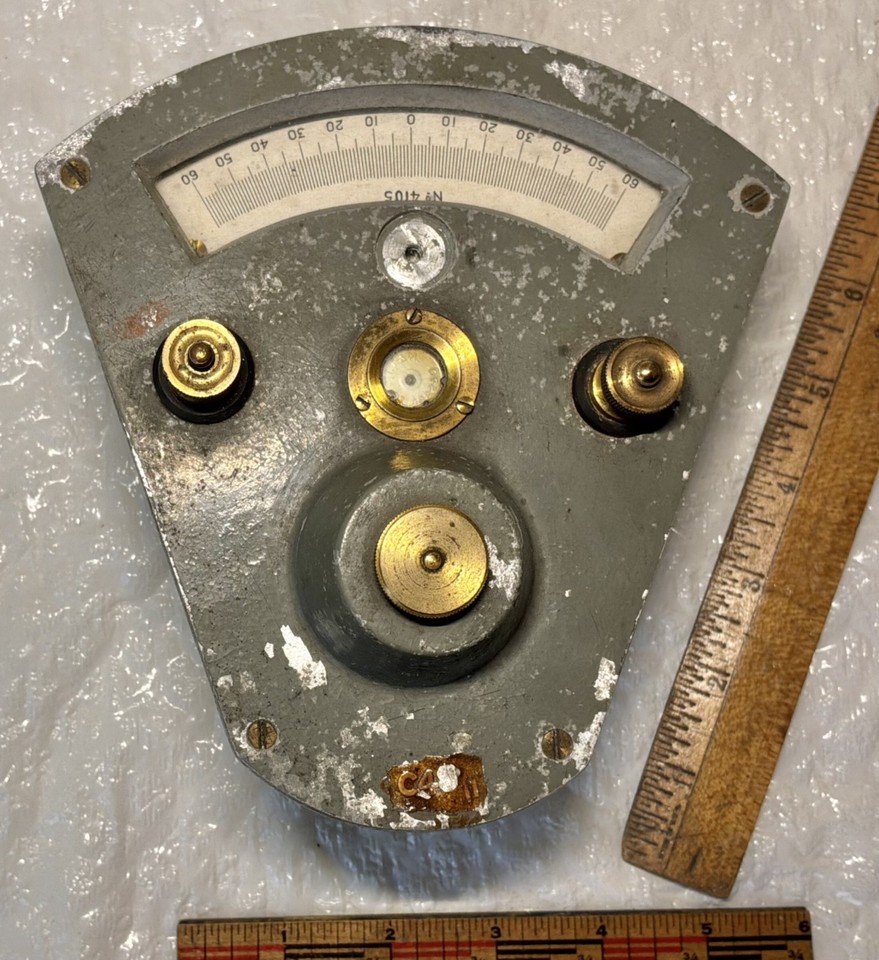 A mystery antique T.T. & H. brass-footed gauge with genuine old science lab energy — you don't know exactly what it measured, and that's half the charm.