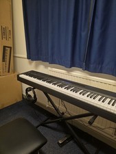 Yamaha P145 Digital Piano Black with X stand, pedal, chair and headphone.