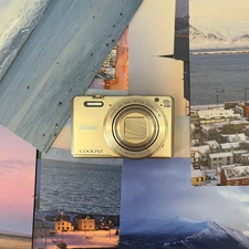 Nikon COOLPIX S7000 16.0MP 20x Zoom Digital Camera English Gold - Tested