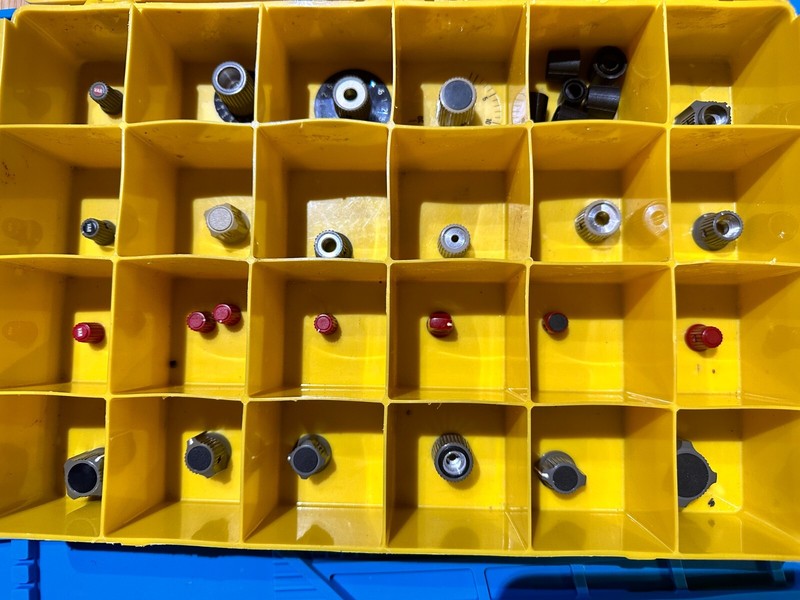 Group of 24 unique (30 total) Vintage Tektronix 366-XXXX knobs in Case red black
