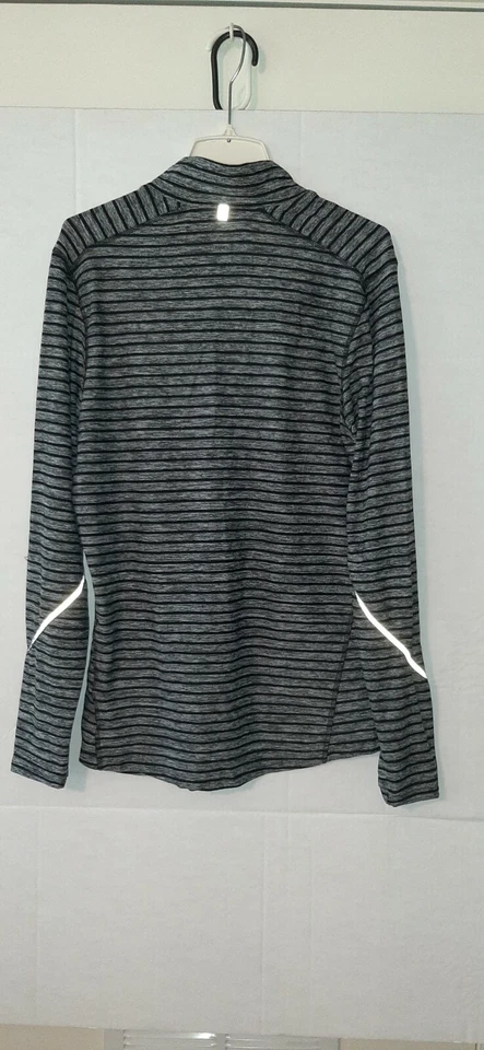 Pullover deportivo trasero para correr con tiras reflectantes - talla mediana para mujer Foto 4 de 4