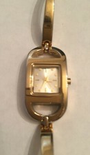 Ladies Womens modern oval case square face gold tone watch needs new battery