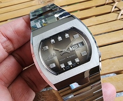 NICE VINTAGE MIDO MULTI STAR AUTOMATIC DAY DATE DRESS GENTS BROWN DIAL.