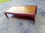 vintage 1930s-40s era coffee table with leather inlay and tiny metal casters