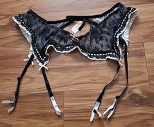 Brand new Victoria  s Secret Black Lace Ruffle Garter Belt. Sz M/L