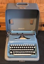 BLUE SCRIPT (CURSIVE?) REMINGTON PERSONAL-RITER PORTABLE MANUAL TYPEWRITER, CASE