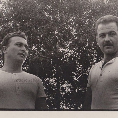 Two Handsome Men Standing Close Strong Presence Direct Gaze Outdoor Vintage Phot