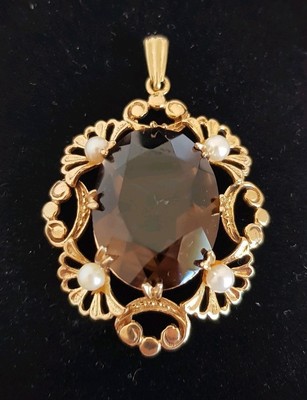 A 9ct Yellow Gold Pendant Set With Large Oval Facet Smoky Quartz Gemstone - 9ct Gold Quartz Pendant A 9ct Yellow Gold Pendant Set With Large Oval Facet Smoky Quartz Gemstone - 9ct Gold Quartz Pendant