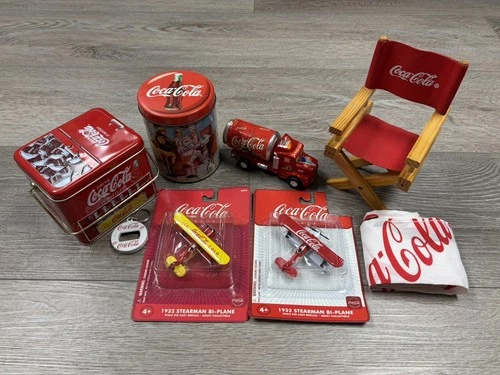 Vintage lot of Coca-Cola collectibles: tins, die-cast, bottle opener, chair