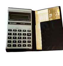 Vintage SHARP ELSI-MATE EL-315S solar cell calculator w/ booklet & case