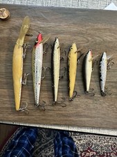 6 Topwater Lures.  Used.. Long & Skinny Down To Deadly Little!
