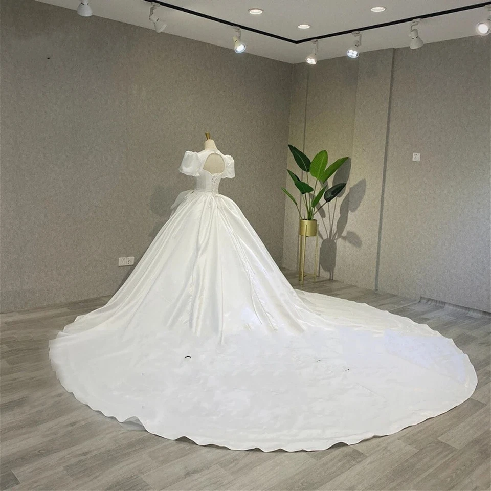 Vestidos de novia mangas abullonadas blancos marfil tren barrido satinado vestidos de novia con lazo Foto 3 de 4