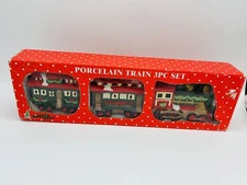 Holiday Trim 3 Piece Porcelain Santa Line Train Set
