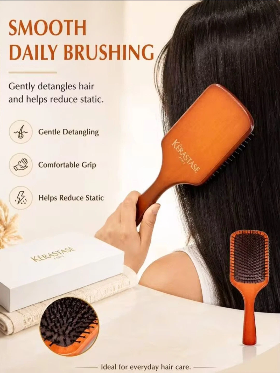 Kerastase wooden paddle brush with orange handle in white box, green/black brush image, and gold �Smooth Daily Brushing� text.