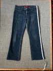 Dark wash 1990s Levi’s Superlow 518 bootcut jeans, waist 31, with yellow measuring tape along the length.