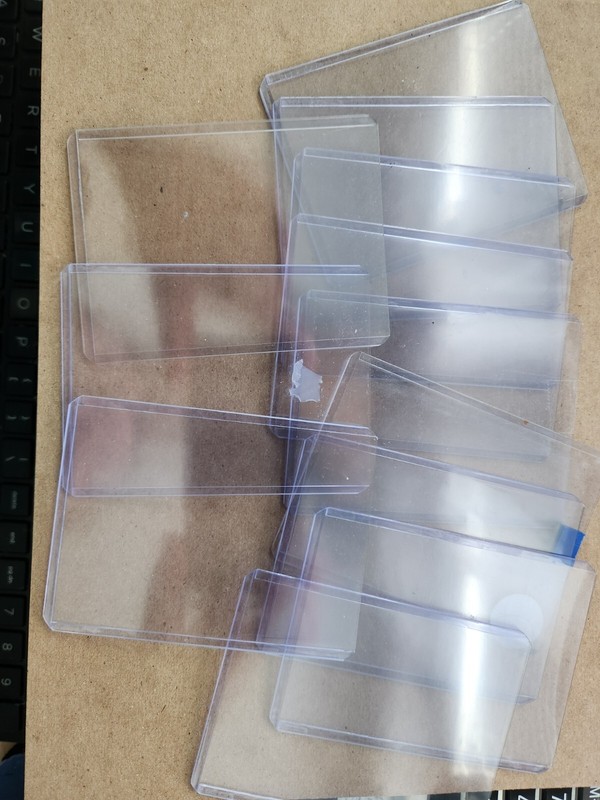 25 3" by 4" trading card protectors/holders.