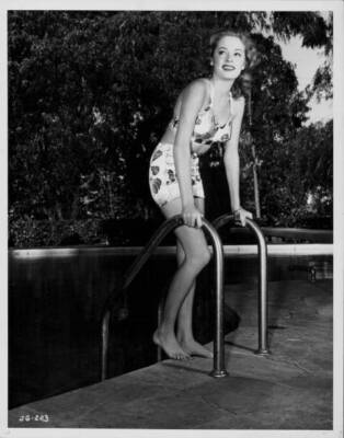 actress Jane Greer, wearing a two piece swimsuit next to a swim - 1950 Old Photo