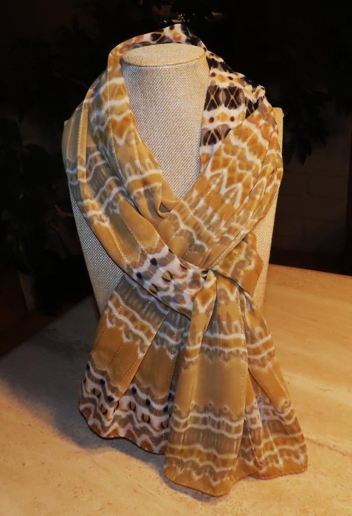 Echo oblong scarf; abstract; tan white black; metallic accents; poly; 72x20 in.