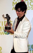 Green Dayss Billie Joe Armstrong poses in the press room with his - Old Photo