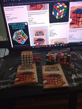 Rubik's Cube- Lot 4 Cube's and 2 1981 Solution Books - vintage