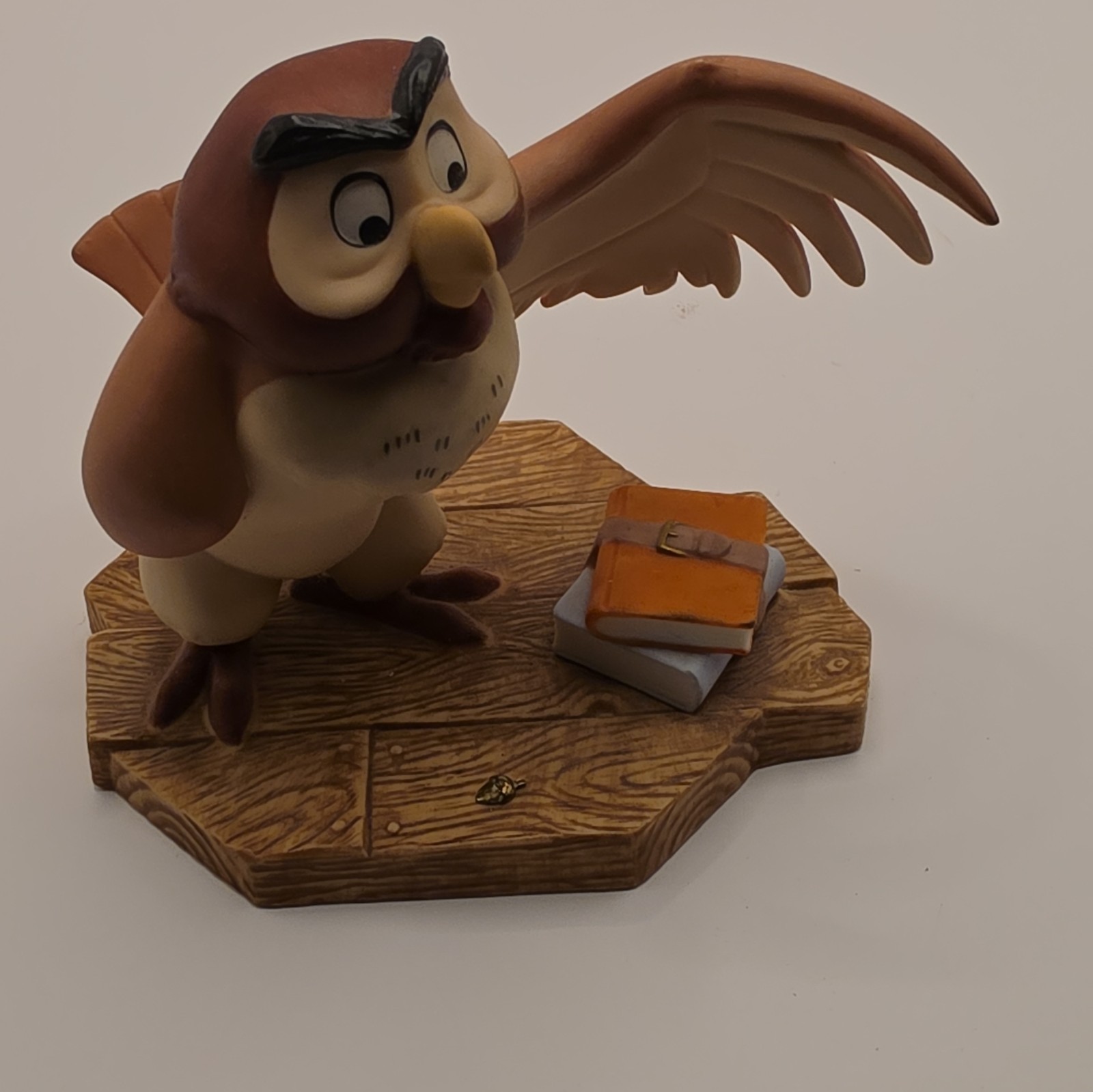 Owl Figurine Bird with Wings Spread on Woodgrain Base with Book