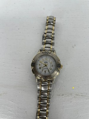 Vtg woman Timex  Indiglo Gold Silver Tone Watch CR 1216 30meters Water Resistant