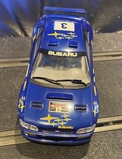 Brand new and in Mint Condition - SCALEXTRIC Blue Subaru Impreza WRC No. 3