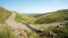 Photo 12x8 Hashy Gill crossing hill road The hill road crosses from Stenne c2020