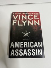 FIRST 2010 EDITION/FIRST PRINT American Assassin, Vince Flynn HCDJ VERY GOOD
