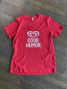 cream and red t shirt