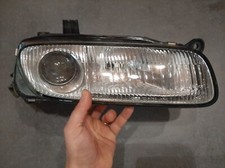 Feu avant (phare) Mazda 323