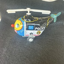 Vintage Tin Police Helicopter Toy w/ Spinning Rotor Wheels made in Korea.
