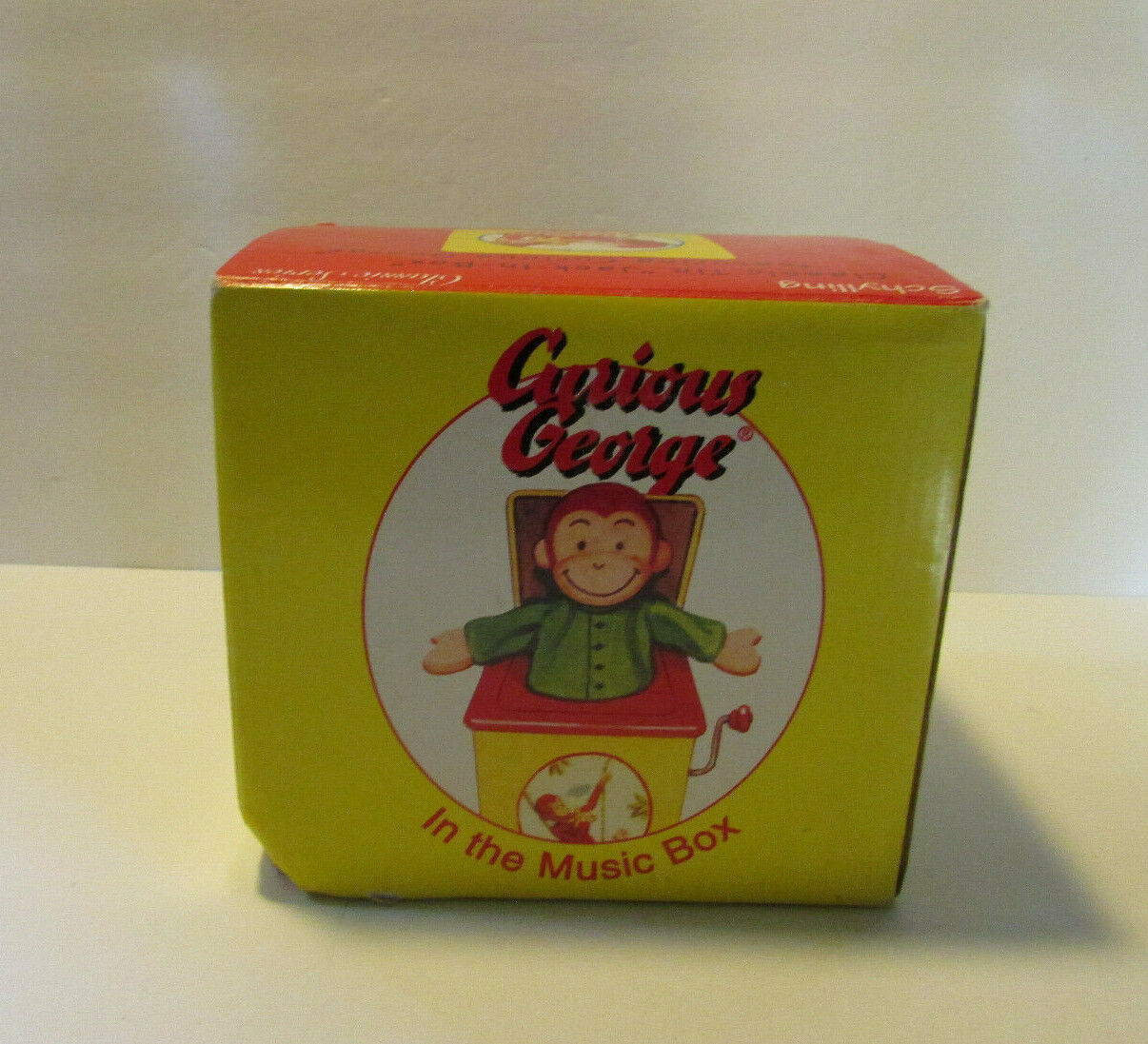 vintage Curious George in the music box classic tin 