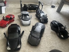 Small Model Casts Luxury Cars Lot
