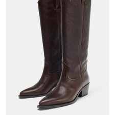 100 Upper Leather high boots. Textured finish. Easy pull-on style....