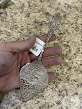 Antique silver repousse cake pie server
