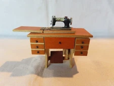 Vintage miniature dollhouse sewing machine on treadle sewing table 1:12 scale