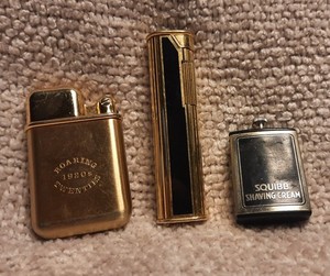Vintage Dunhill ,gold color. Vintage roaring 20s lighter permanent match squibb