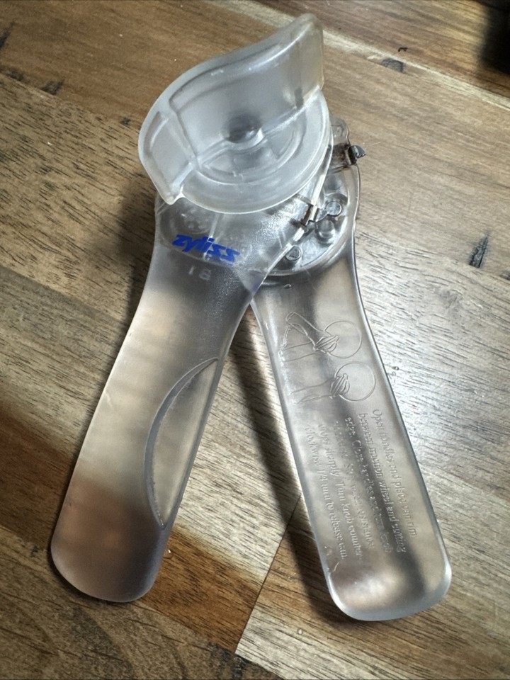 A patented Swiss-engineered clear-bodied can opener from ZYLISS — a rare mechanical curiosity you can actually see working, built to last decades.