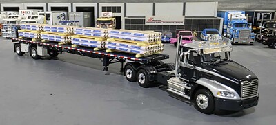 1/64 DCP / FIRST GEAR MACK PINNACLE WITH PAPER TUBES LOADED TRAILER 60-1954