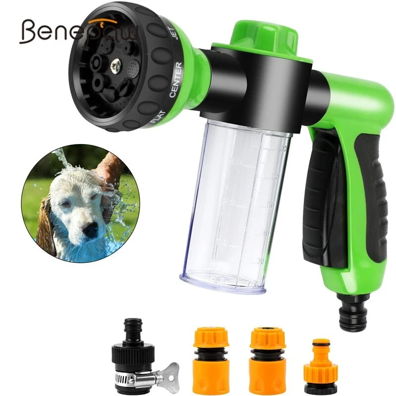 Spraying dog top with water hose