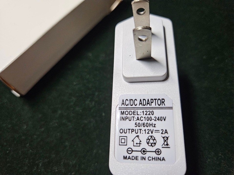 AC/DC ADAPTER OUTPUT: 12V 2A INPUT: 100-240V 50/60Hz MODEL: HXN 1220 ...