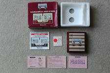 Thumbnail of ebay&reg; auction 167488663506 | VERPACKTES NINTENDO CGL SPIEL UND UHR MARIO BROS MW-56 1983 GUTER ZUSTAND